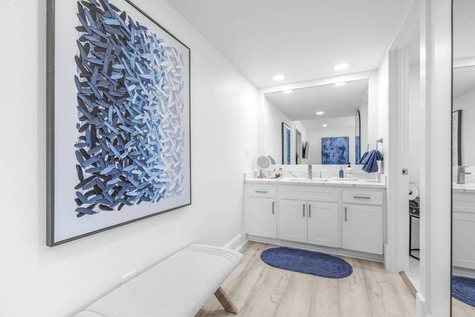 Spacious bathroom layout with easy access from the bedroom and plenty of room to get ready.