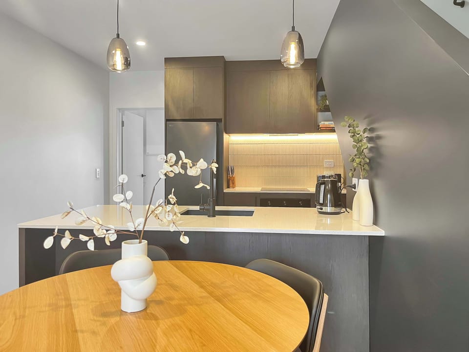 Contemporary kitchen with sleek finishes and warm lighting