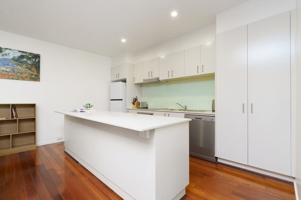 Sleek kitchen with appliances at hand, making every meal preparation effortless.