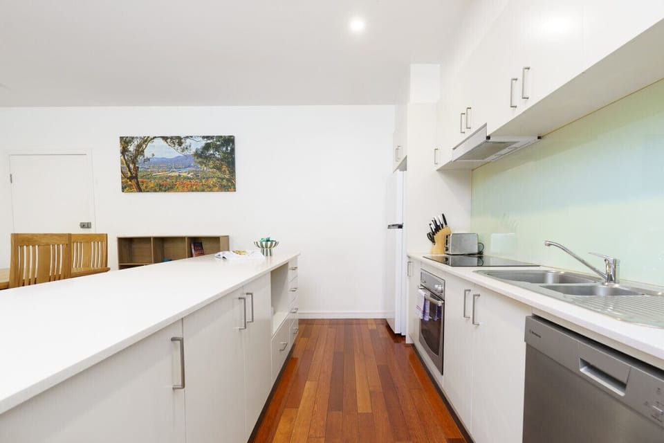 Sleek kitchen with appliances at hand, making every meal preparation effortless.