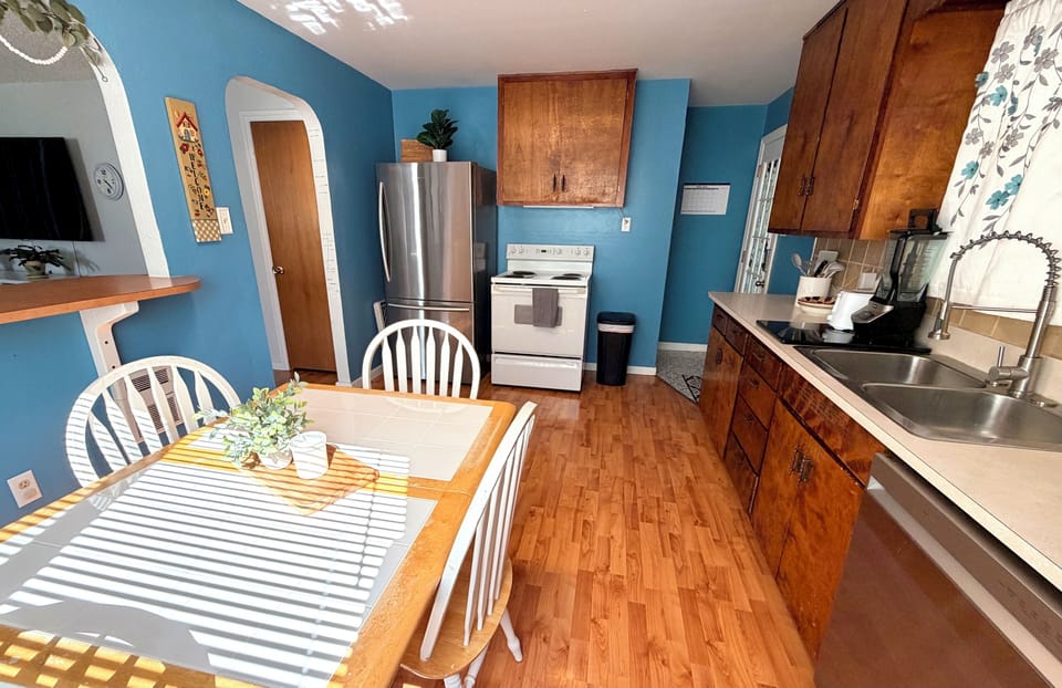 Fully stocked kitchen with spices, utensils, and accessories