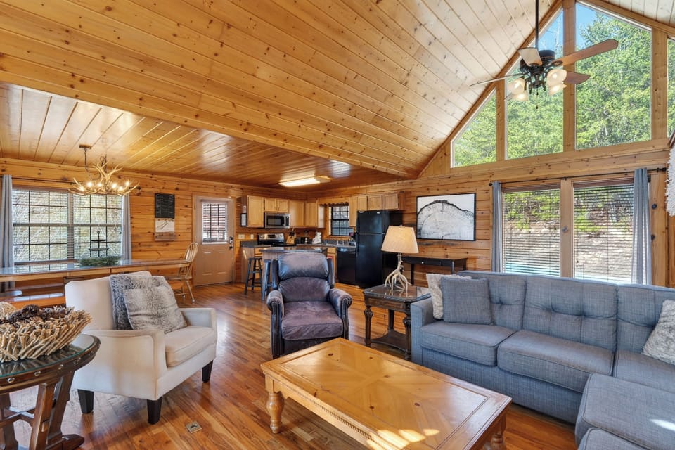 Comfortable seating area with a mix of plush armchairs and a large sofa.