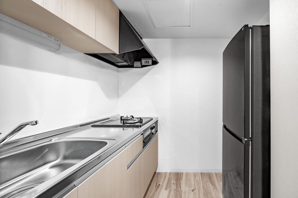 Apartment | Private kitchen | Fridge, microwave, stovetop, cookware/dishes/utensils