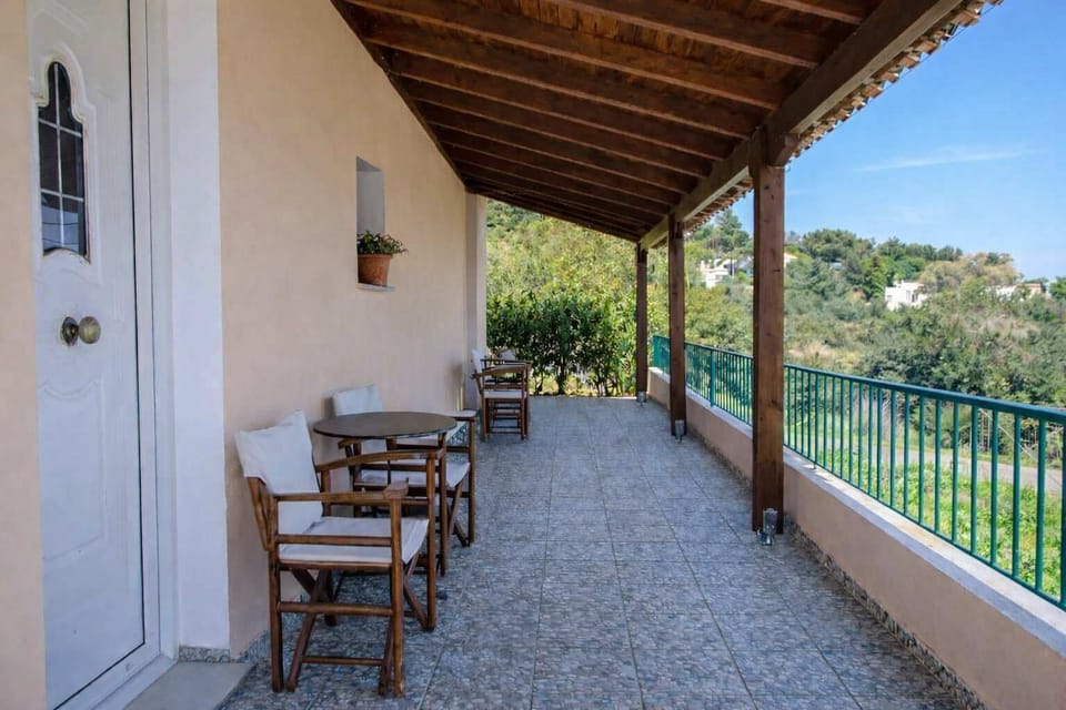 Spacious covered patio with seating and peaceful views.