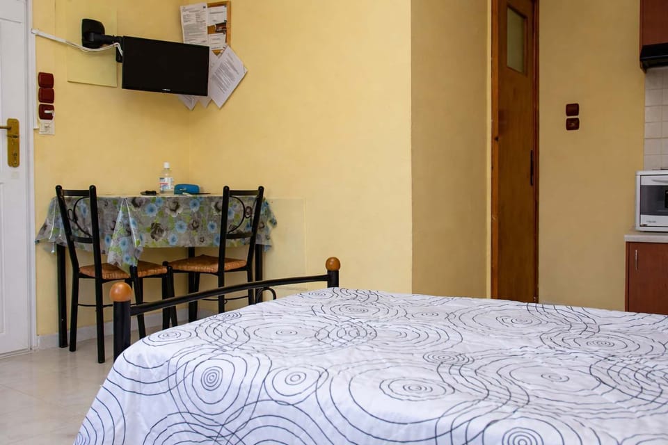 Bedroom with dining area and TV for added comfort.