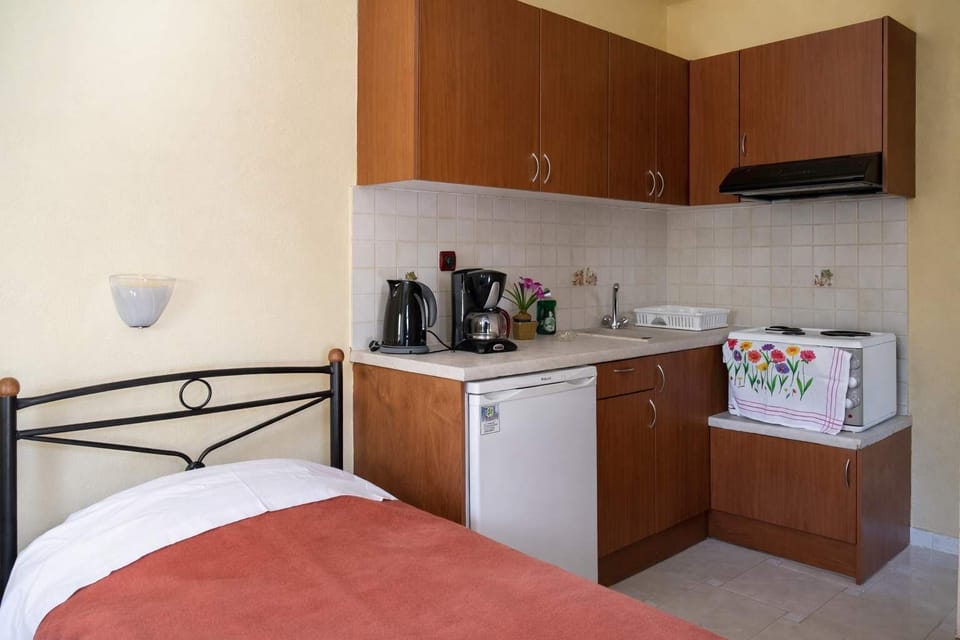 Cozy sleeping area with kitchenette for easy meals.