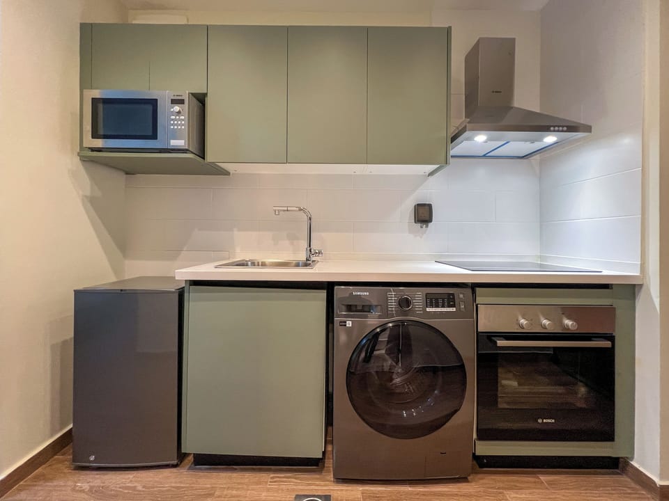 Classic Studio, City View | Private kitchenette | Mini-fridge, cookware/dishes/utensils, cleaning supplies, paper towels
