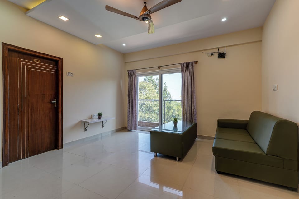 Deluxe Apartment | Living area | TV