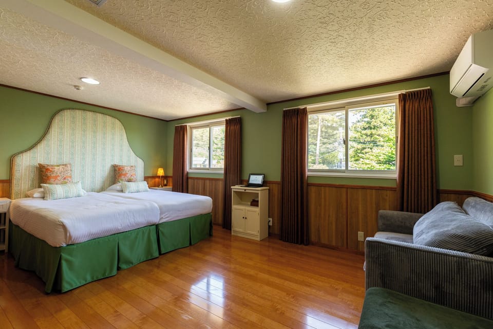 Premium bedding, desk, laptop workspace, blackout drapes