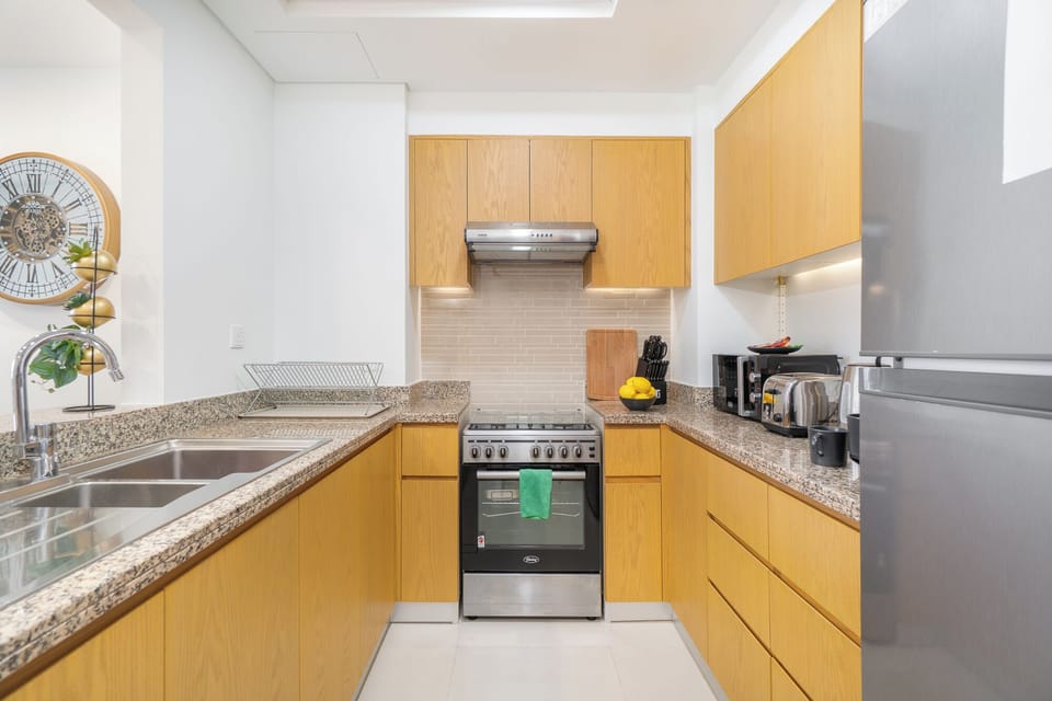 Luxury Apartment, Balcony, Pool View | Private kitchen | Full-size fridge, microwave, oven, stovetop