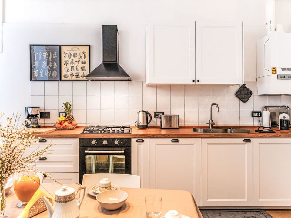 Kitchen Appliance, Kitchen, Countertop, Major Appliance, Kitchen Stove, Cabinetry, Interior Design, Stove, Gas Stove, Wood