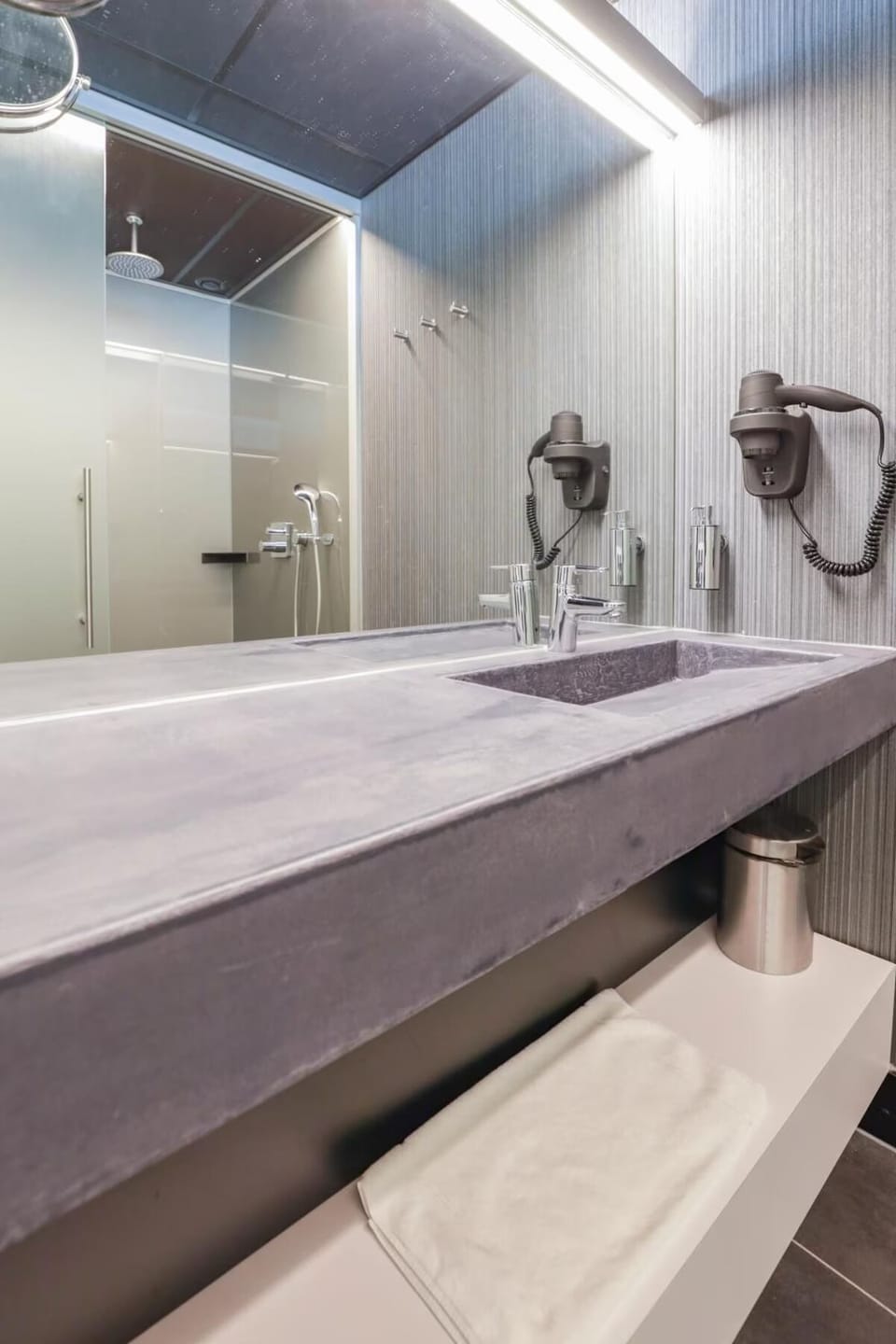 Start the day at a sleek vanity with spa-like lighting.