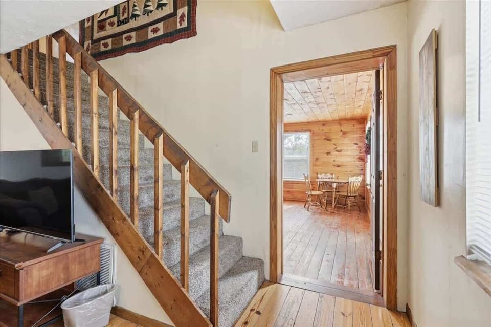 Step into your cozy retreat where rustic wood meets comfort - natural light flows through inviting spaces perfect for relaxation.