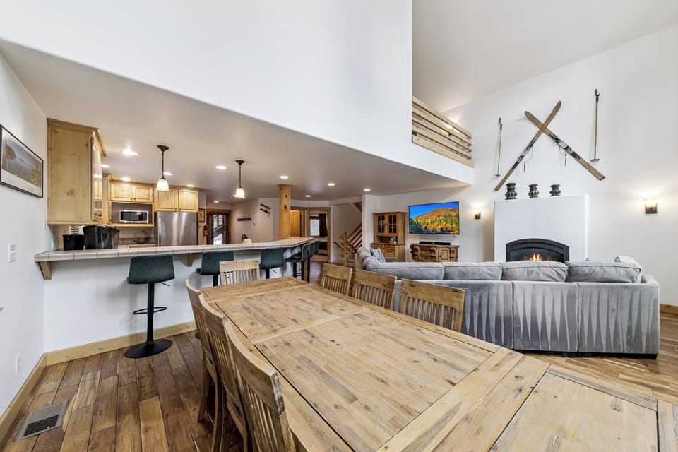 Gather around the rustic dining table while your chef prepares meals in the open kitchen, then unwind by the cozy fireplace.