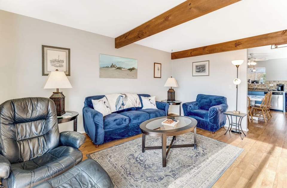 Comfortable Living Area is dressed in beachy blues and serene coastal decor.