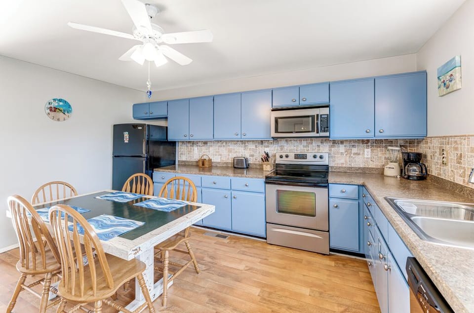 We just love the beachy blue cabinetry!