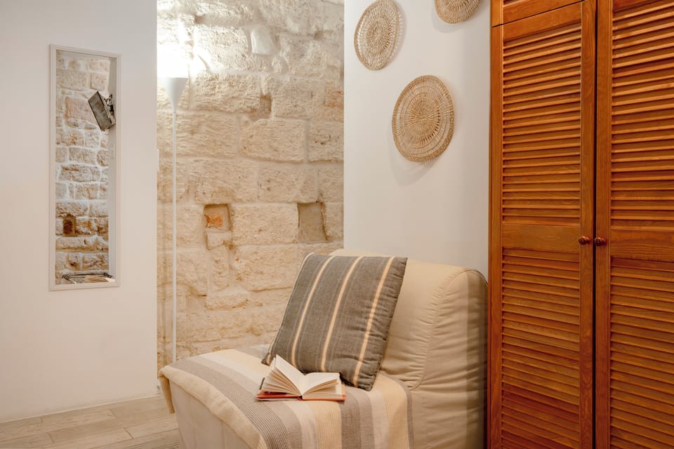 Deluxe Apartment, Balcony, City View | Living area | 32-inch flat-screen TV with digital channels