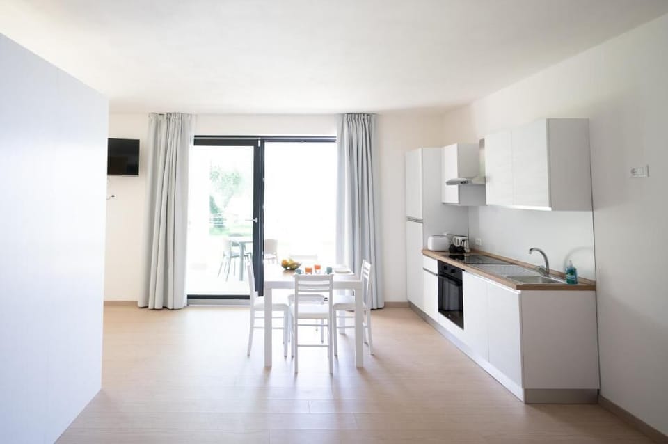 Apartment, Patio, Lake View | Private kitchen