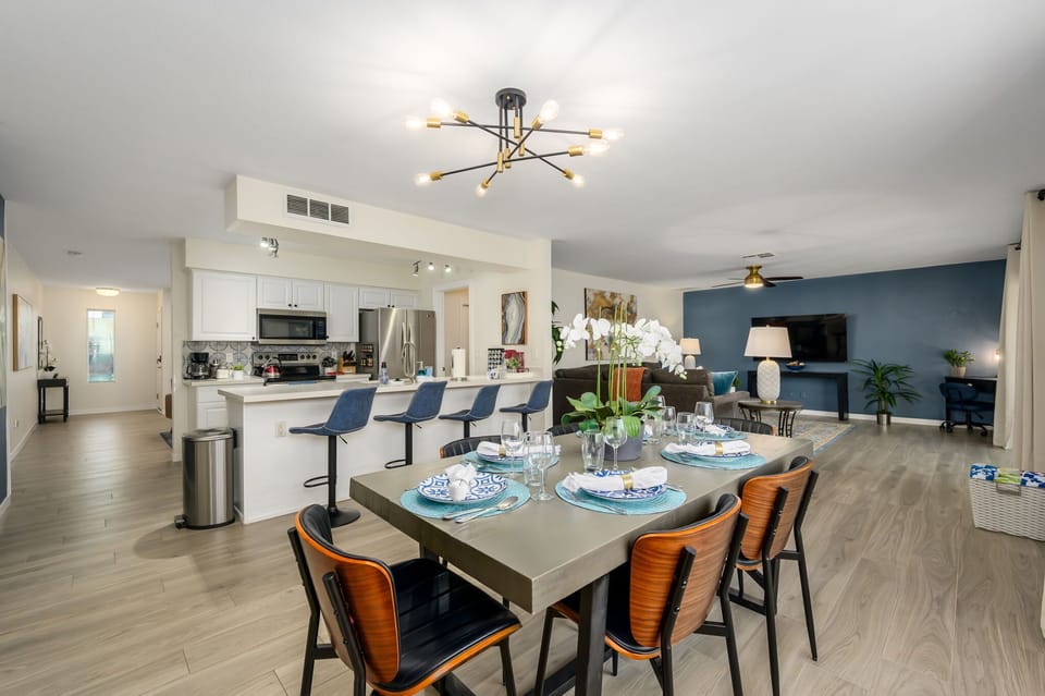 Spacious dining area and fully equipped kitchen with bar seating.
