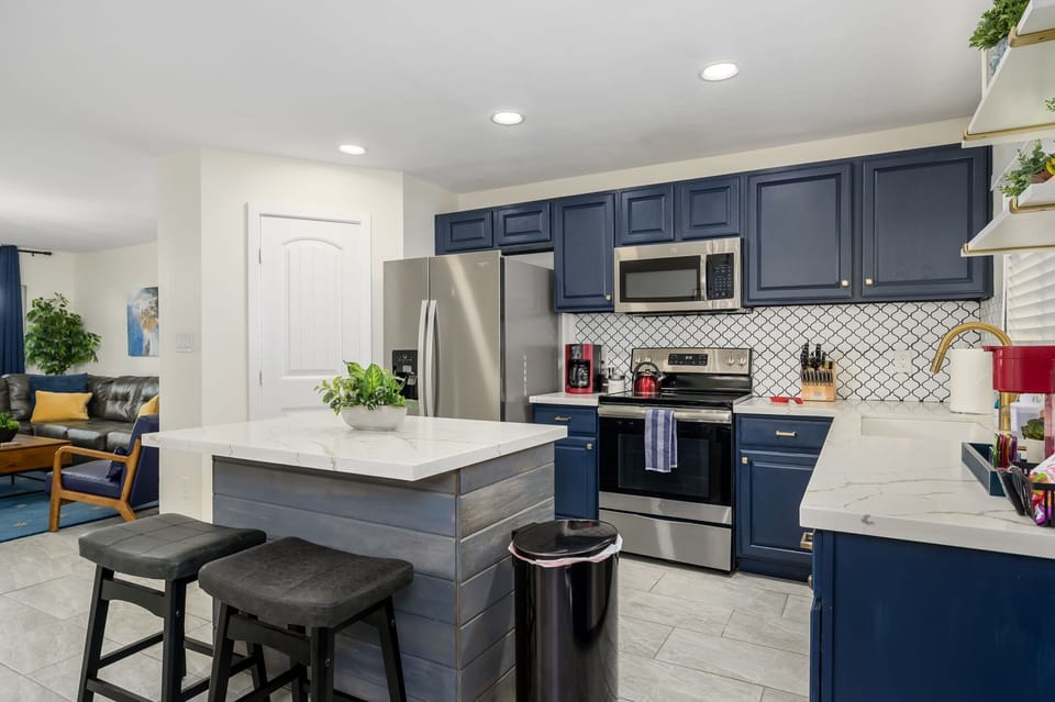 Kitchen with an open layout and island seating.