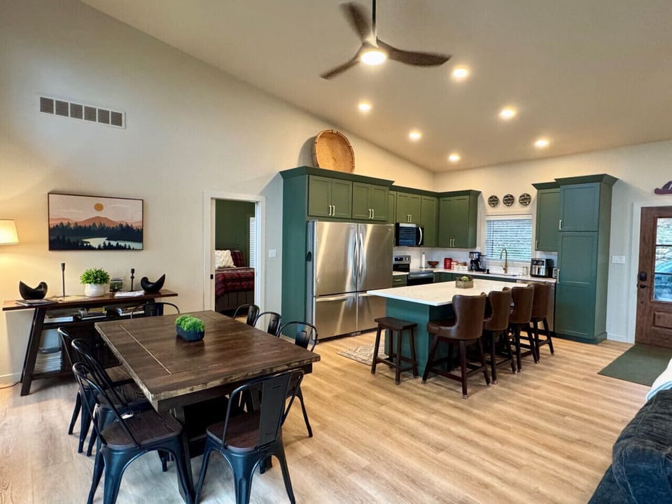 open concept kitchen, double fridge/freezer and island that seats 6, kitchen table for 8