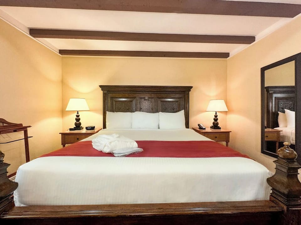 Sink into a king bed dressed in crisp, hotel linens.