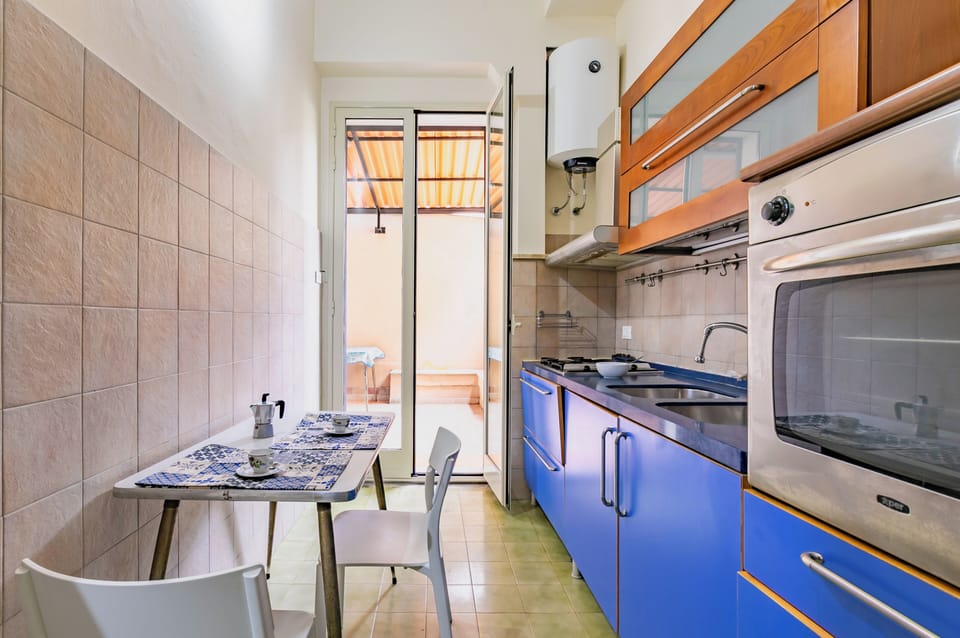 Apartment | Private kitchen | Full-size fridge, oven, stovetop, cookware/dishes/utensils
