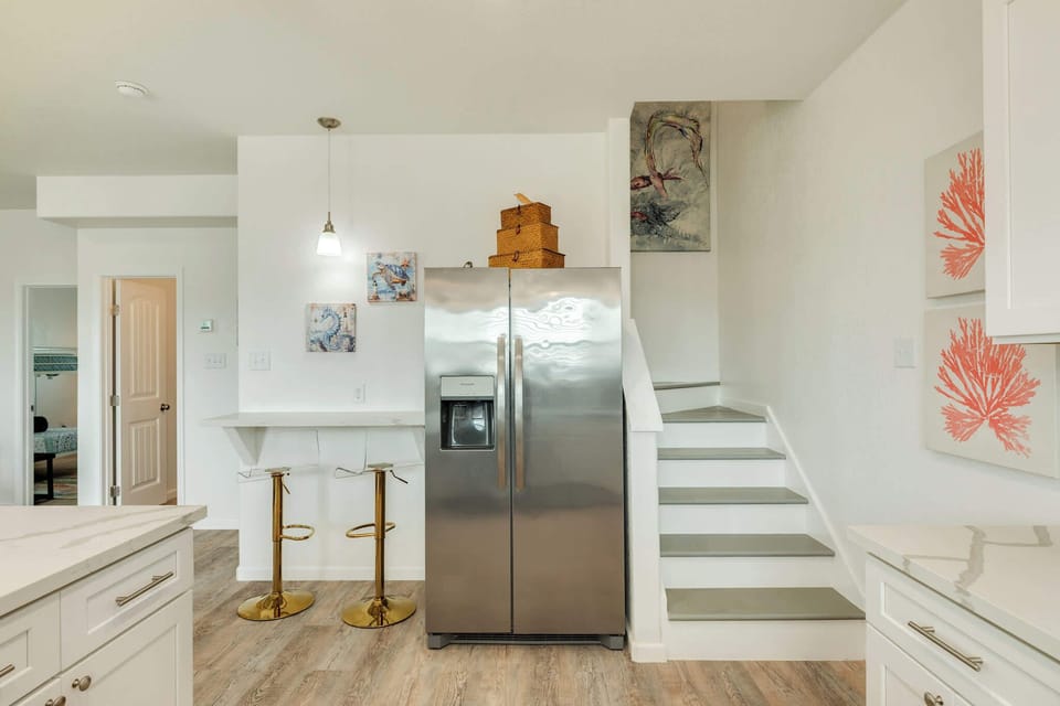 Stairs leading to the 3 bedrooms and 2 bathrooms upstairs 