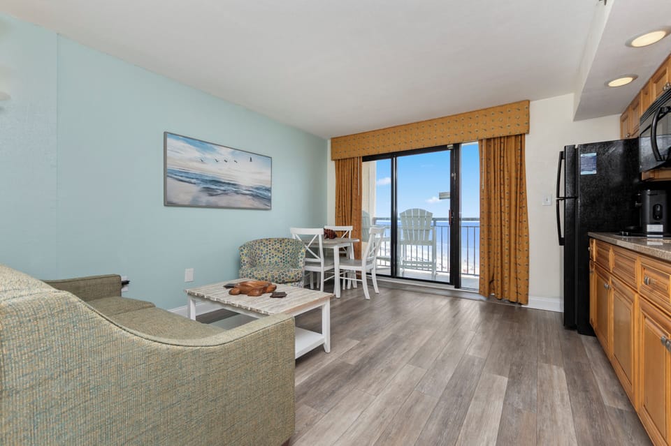 Bright coastal condo with balcony dining and beautiful ocean views