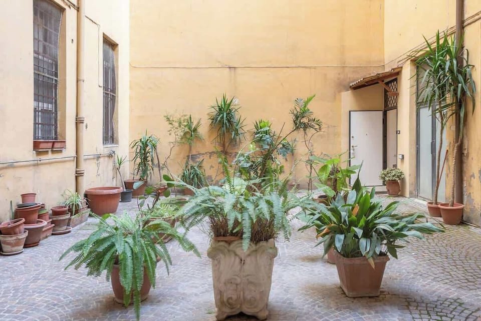 The access to the apartment is through a little court.