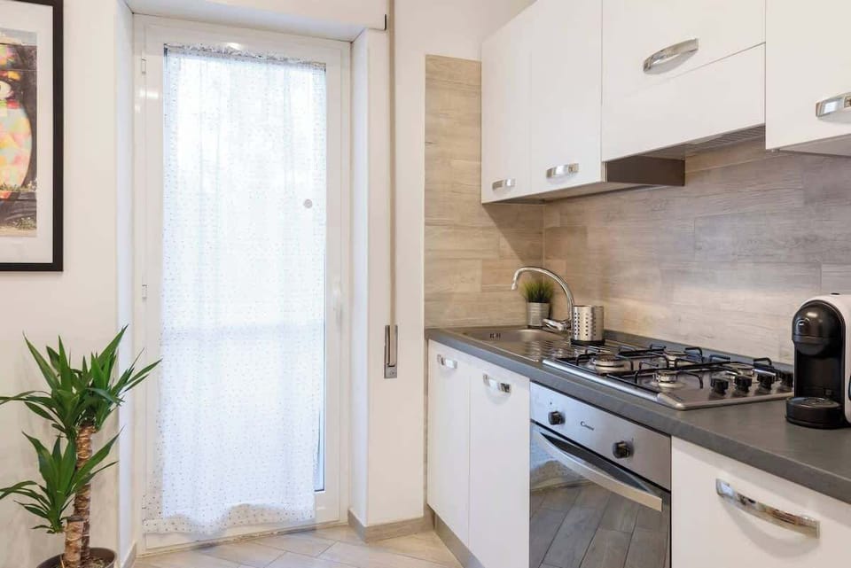 Full kitchen with a little balcony.