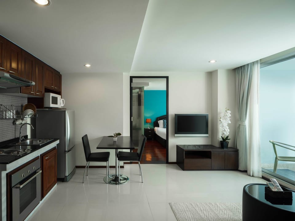 Standard Double Room, 2 Bedrooms | Living area | 32-inch flat-screen TV with cable channels, TV