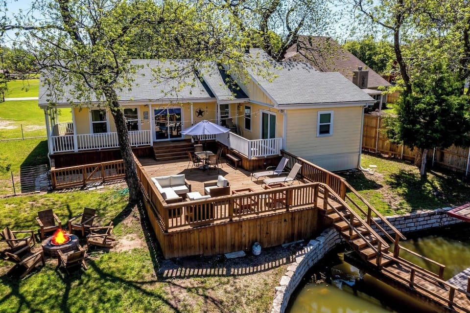 Private Lake Granbury waterfront home with oversized deck and direct dock access — perfect for sunset views, fishing, and relaxing by the water.