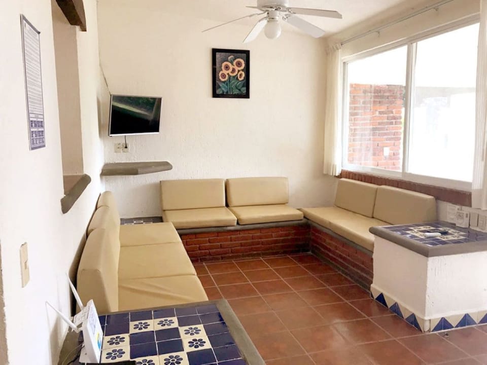 Standard Cabin | Living area | 32-inch flat-screen TV with cable channels