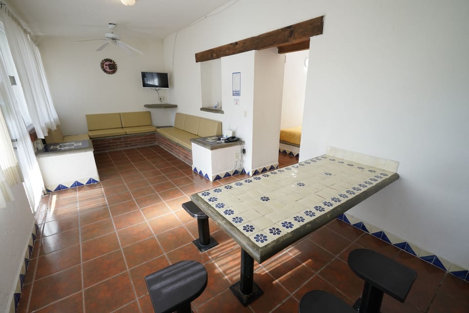 Standard Cabin | Living area | 32-inch flat-screen TV with cable channels