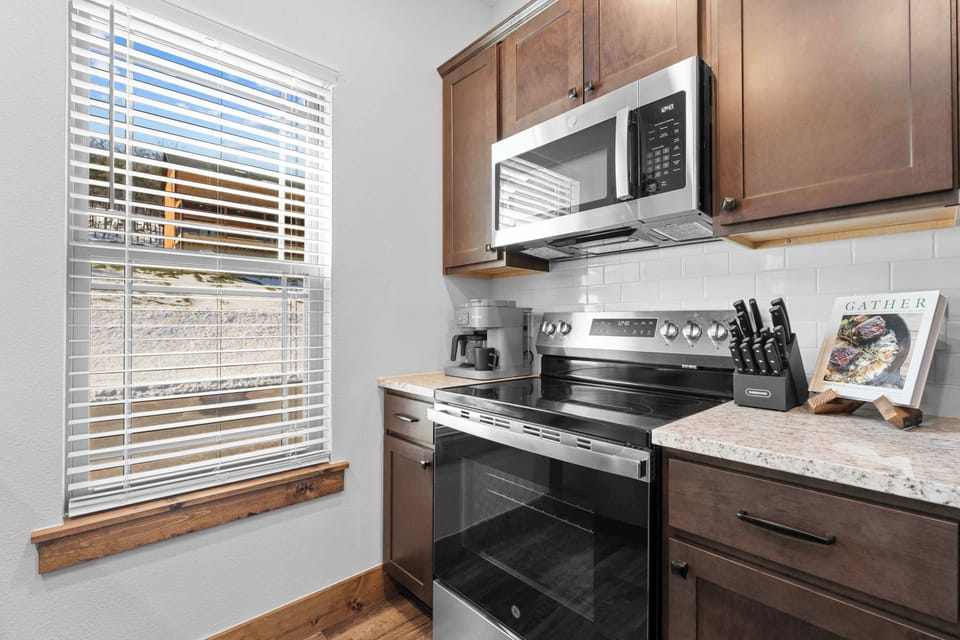 The open kitchen offers ample space & all the comforts of home​
