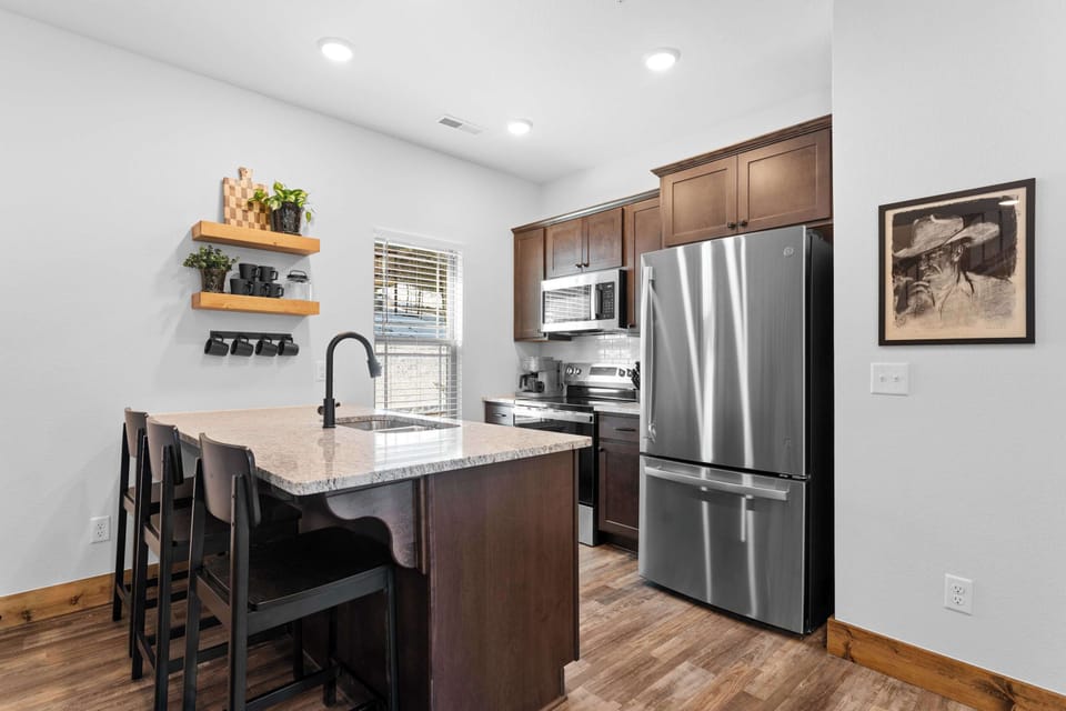 The open kitchen offers ample space & all the comforts of home​