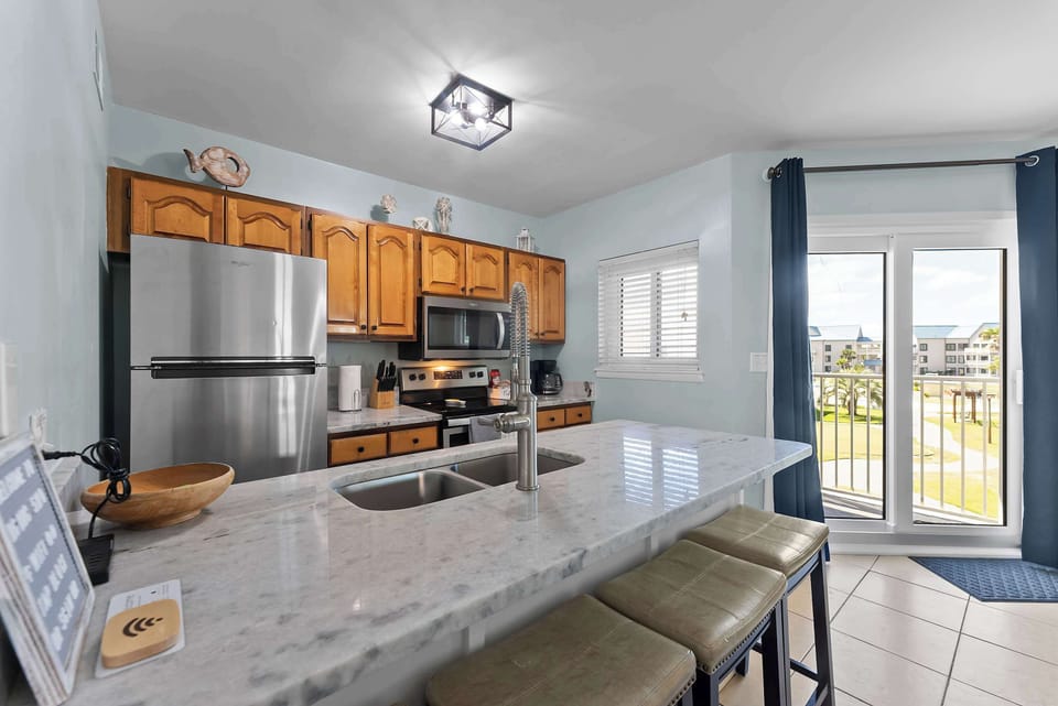 Another view of the kitchen and breakfast bar, perfect for quick meals