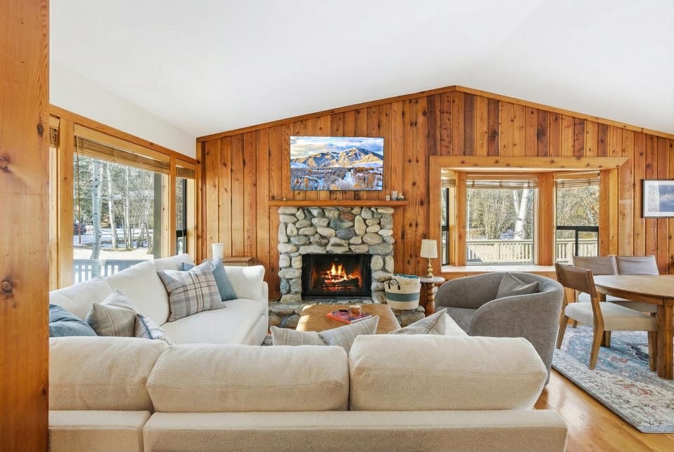 Cozy up by the stone fireplace after a day on Baldy