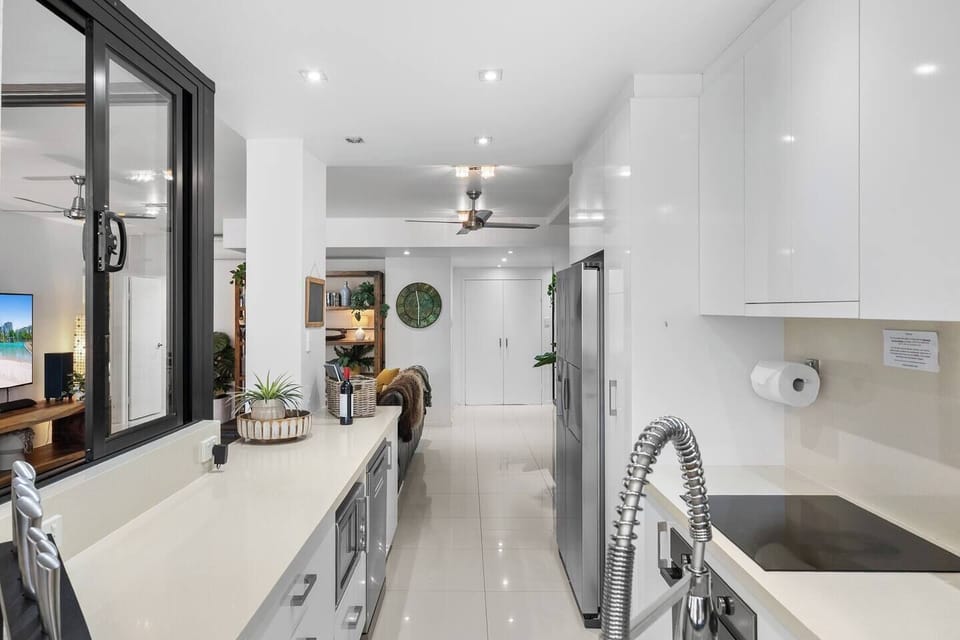Designed for both convenience and style, this contemporary kitchen offers premium appliances, generous bench space, a large fridge, dishwasher and plenty of storage. The open design and servery window make cooking, serving and entertaining a breeze.