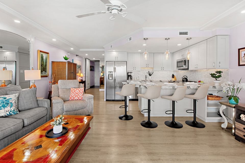 Open-concept layout connecting the modern kitchen to the comfortable living space.