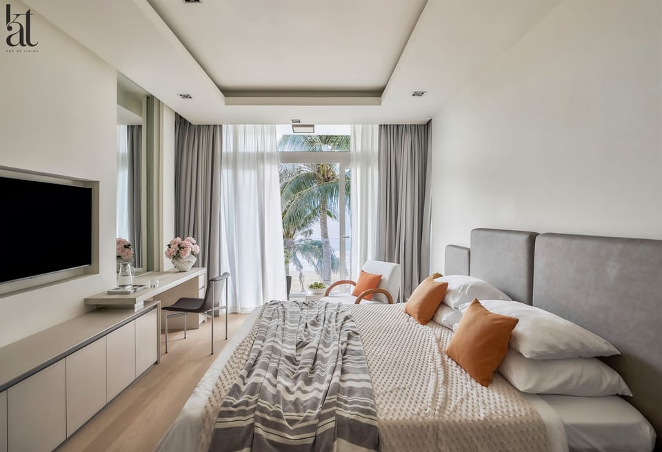 Master Bedroom with balcony overlooking the beach and desk area. 55" Smart TV