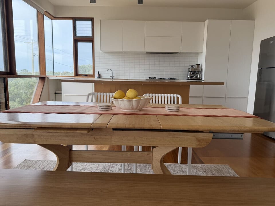 Spacious dining area adjoining the open-plan kitchen, perfect for shared meals and entertaining.
