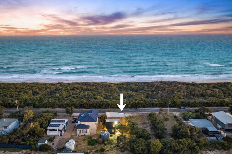 Aerial view showing the home’s prime location just a short walk from Golden Beach.