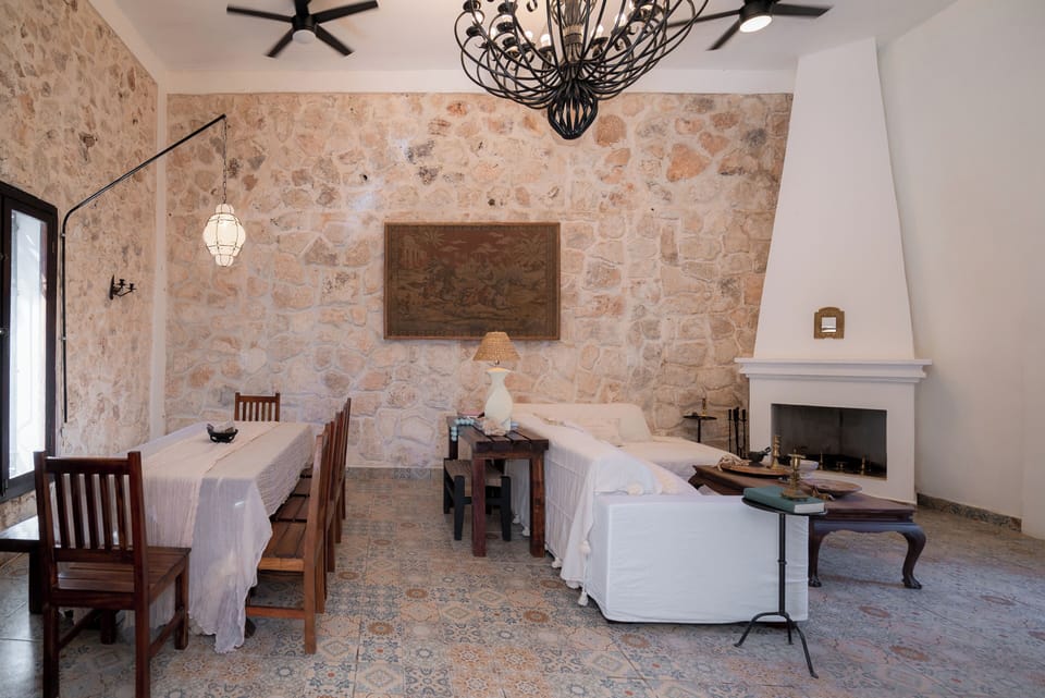 Main living room, dining seating up to 10, and entertainment space with TV