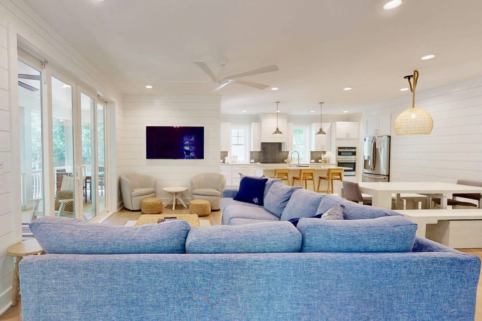 Double glass sliding doors offer copious amounts of natural light in the living area