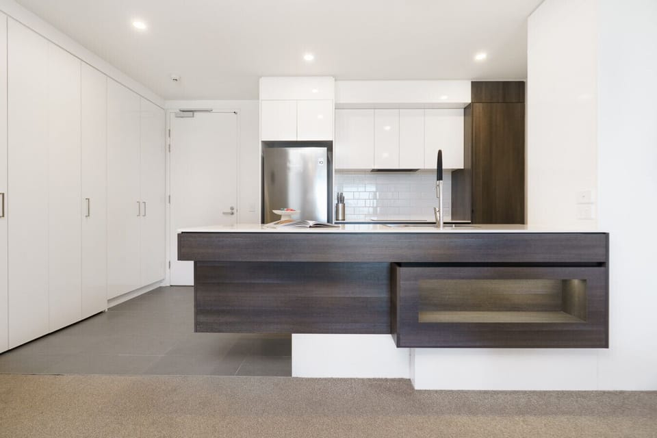 A sleek, fully equipped kitchen with quality appliances and plenty of bench space – perfect for cooking up a feast or preparing a quick brekkie before heading out.
