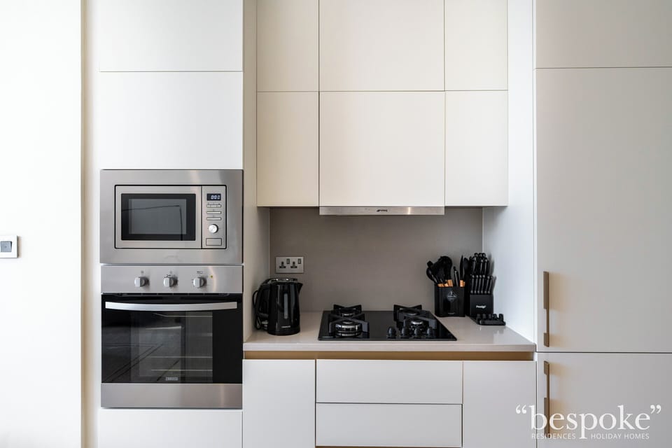 Deluxe Apartment, 2 Bedrooms, Partial Sea View | Private kitchen | Fridge, microwave, oven, stovetop