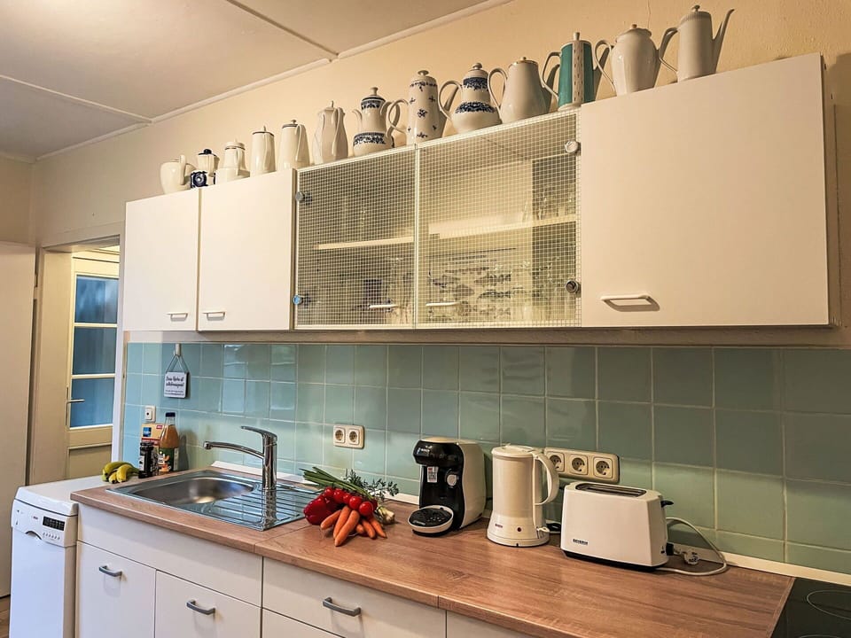 Kitchen, Kitchen Appliance, Interior Design, Countertop, Cabinetry, Kitchen Sink, Lighting, Major Appliance, Room, Cupboard