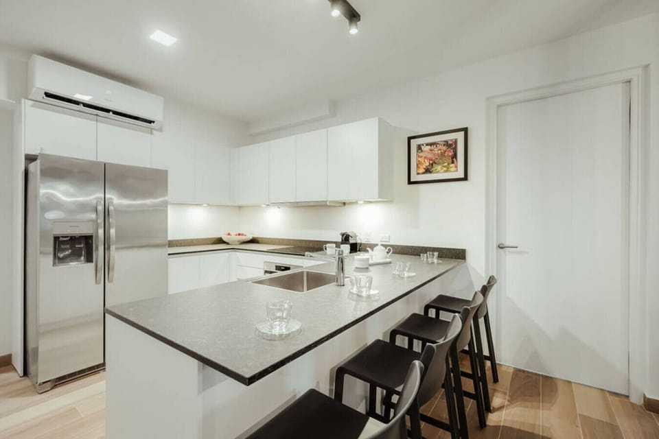 Start your mornings with fresh coffee and tropical fruit at the spacious, modern kitchen island.